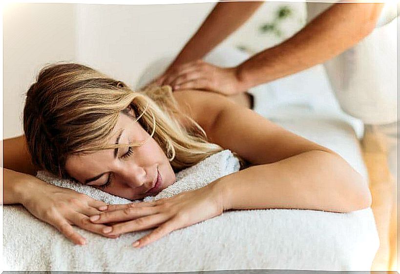 Blonde girl getting a massage.