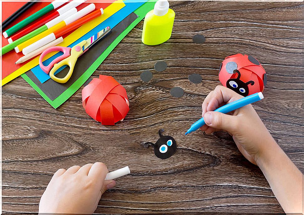 Child hands making crafts.