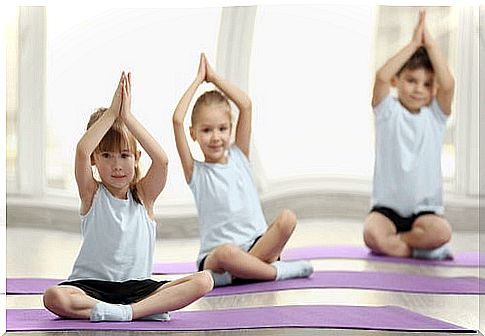 Children doing yoga.