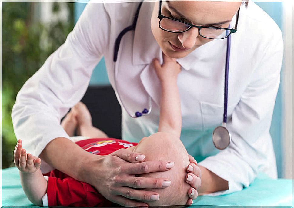 Doctor touching child's head