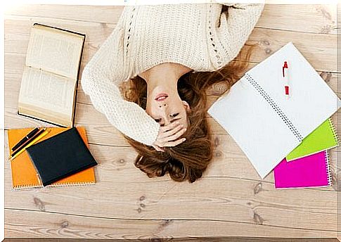 Stressed woman lying on the floor.