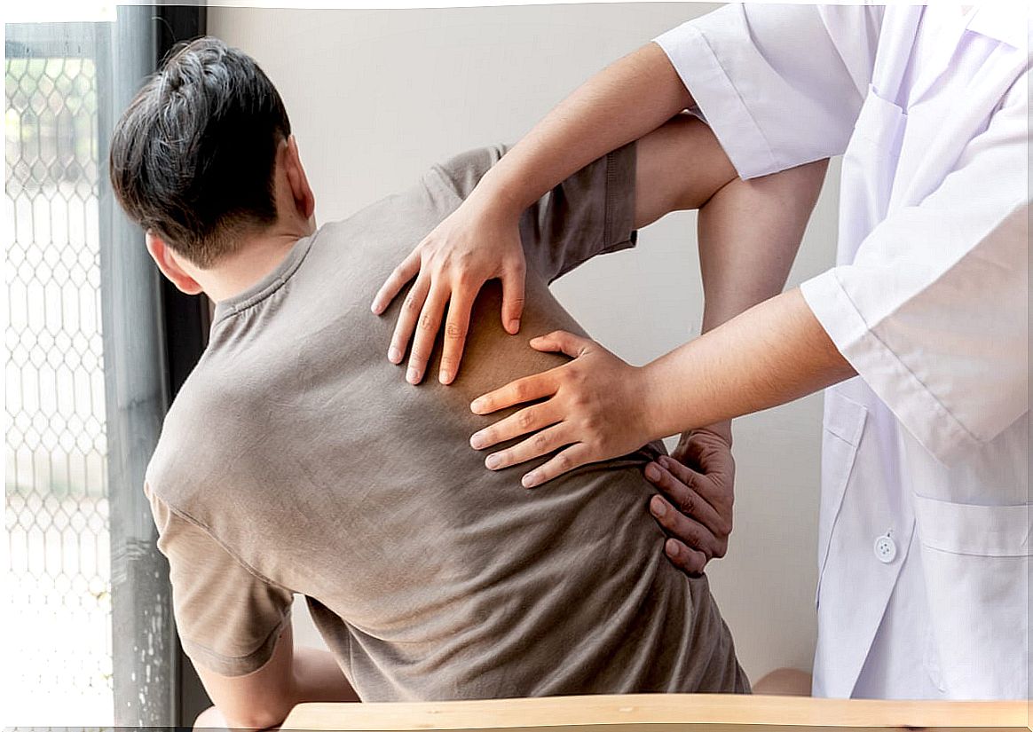 Doctor and patient with shoulder pain