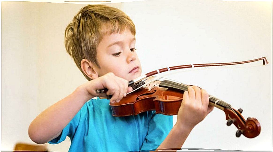 Boy playing the violin.