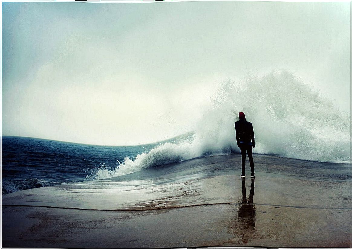 Person in front of the ocean with fear.